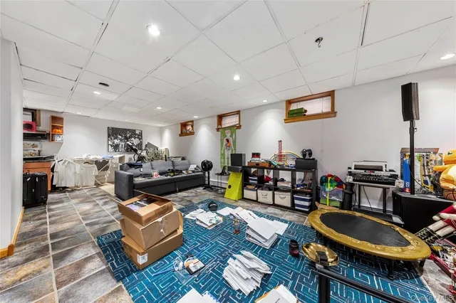 a living room with lots of furniture and a wooden floor