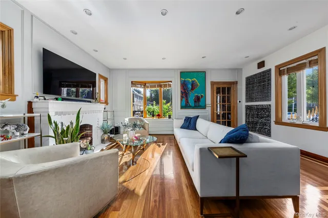 a living room with fireplace furniture and a flat screen tv