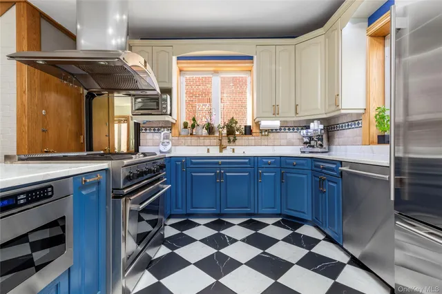 a kitchen with a sink stove and microwave