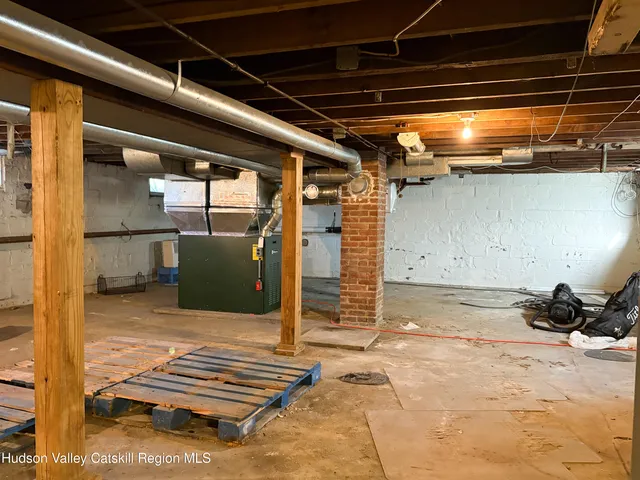 a view of room with wooden floor