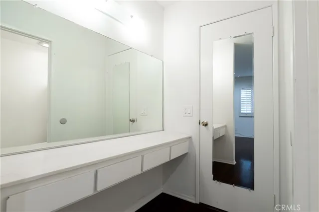 a bathroom with a shower and a sink