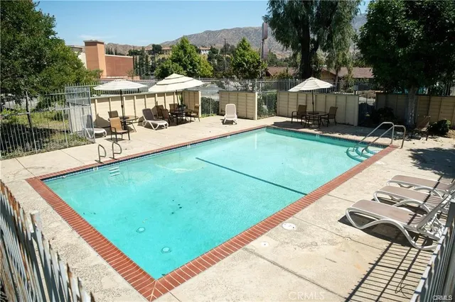 a view of a swimming pool with a patio