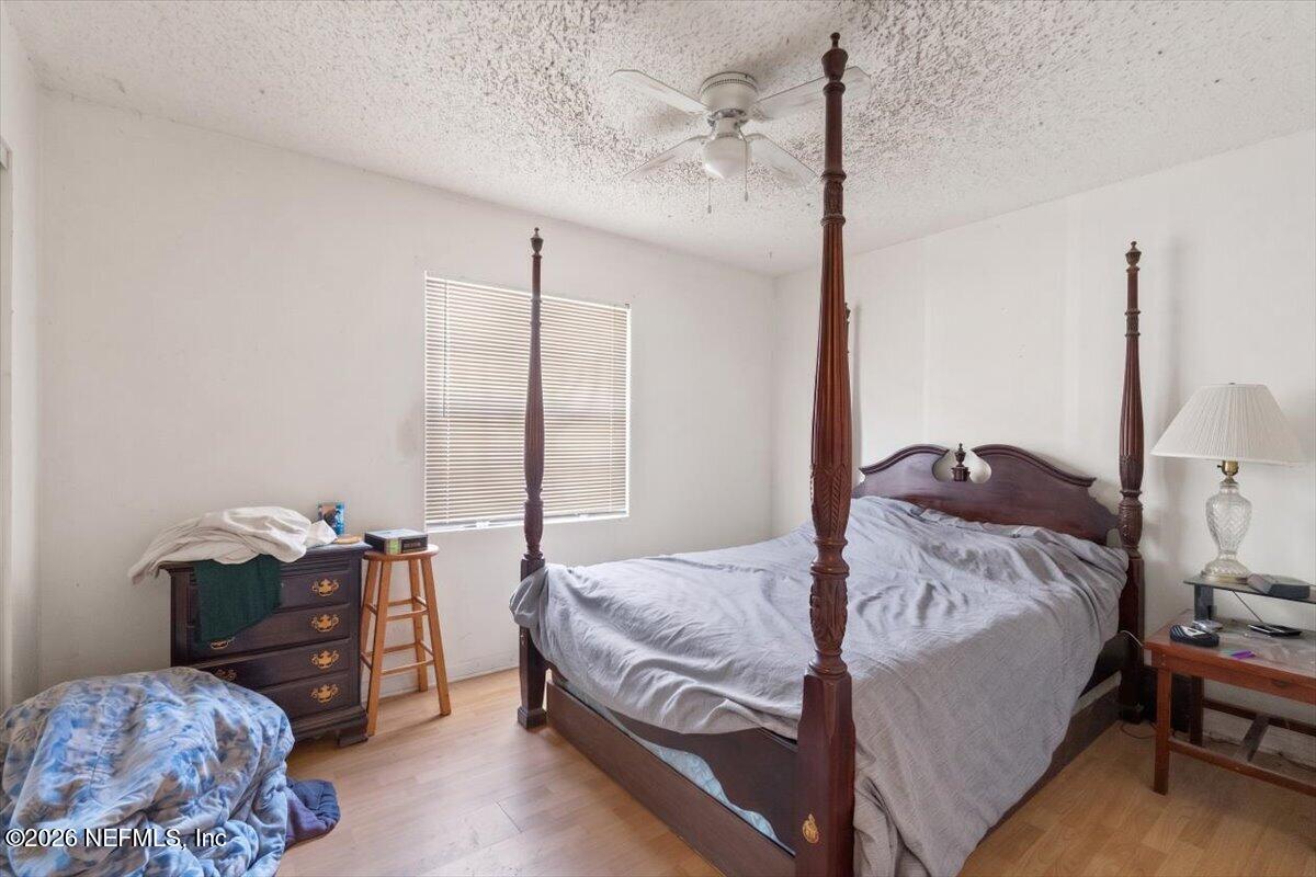 2910 Post Street Jacksonville, FL 32205 - Photo 15 of 34 a bedroom with a bed and wooden floor