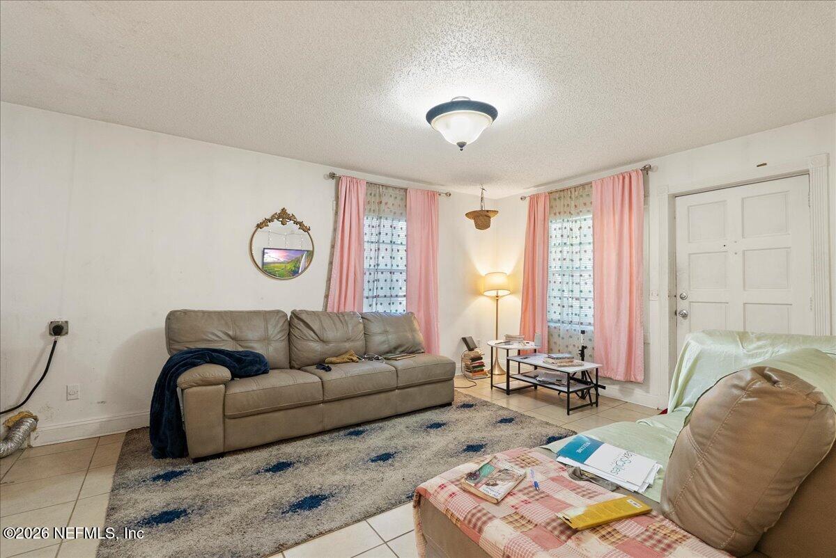 2910 Post Street Jacksonville, FL 32205 - Photo 17 of 34 a living room with furniture and a large window