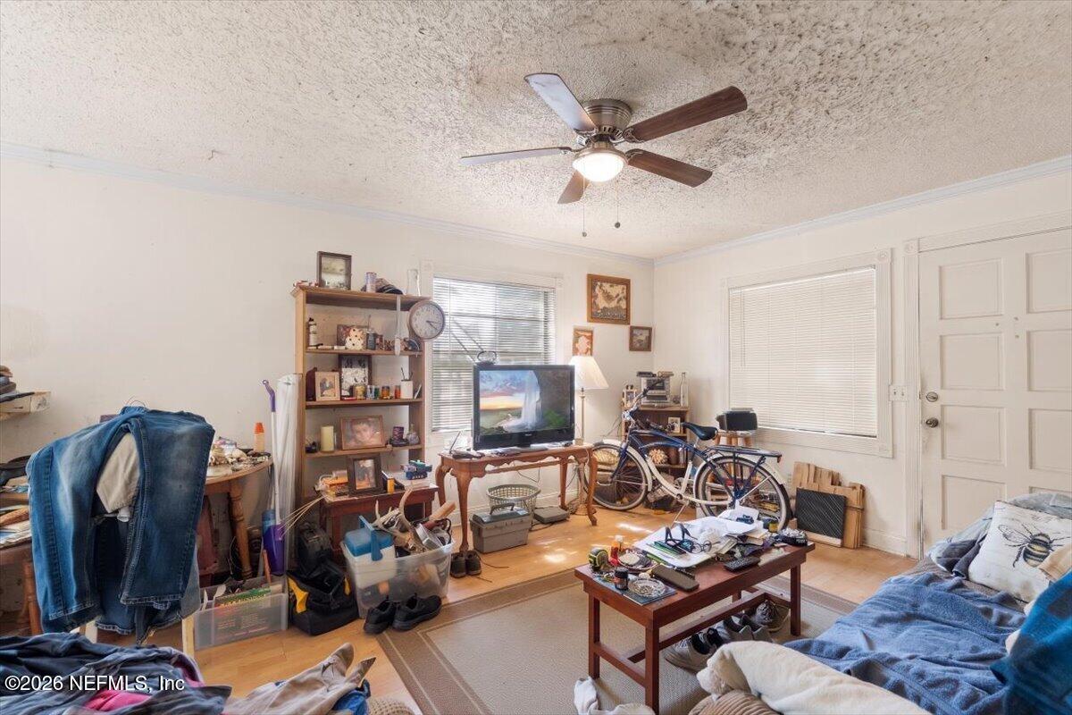 2910 Post Street Jacksonville, FL 32205 - Photo 4 of 34 a living room with furniture a air conditioner and a window