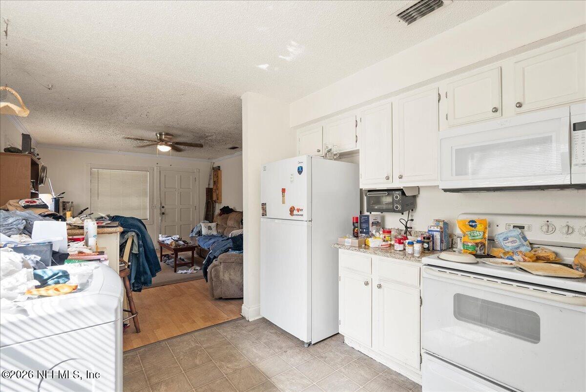 2910 Post Street Jacksonville, FL 32205 - Photo 7 of 34 a view of kitchen with cabinets and refrigerator