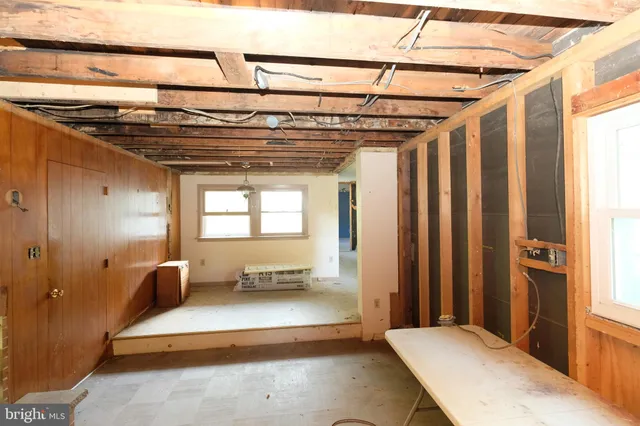 a view of a room with wooden walls
