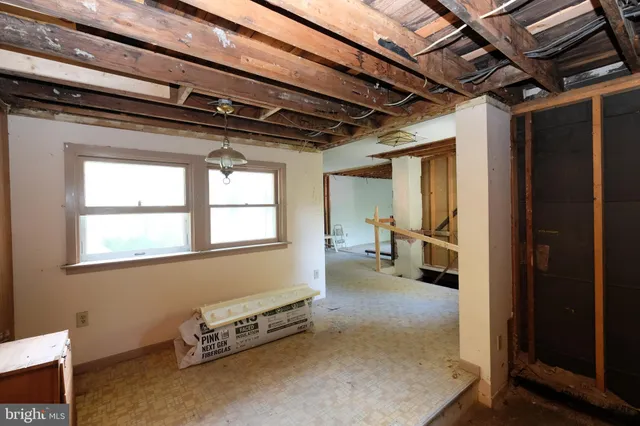 a view of a hallway with windows