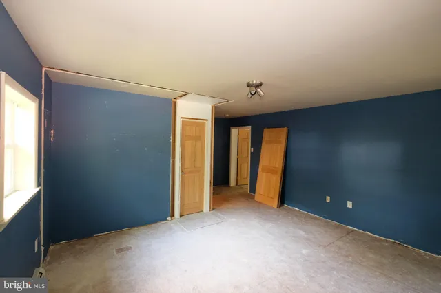 a bathroom with a sink mirror and shower