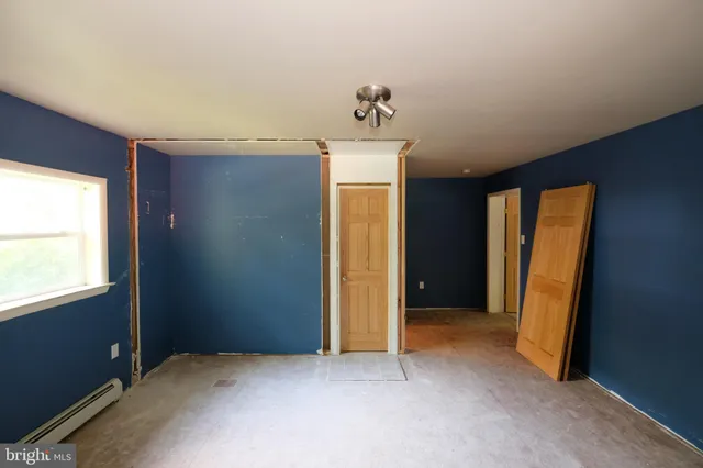 a white toilet and shower sitting next to a bathroom sink