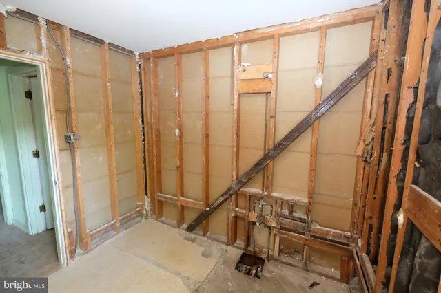 a view of a livingroom with furniture and a window