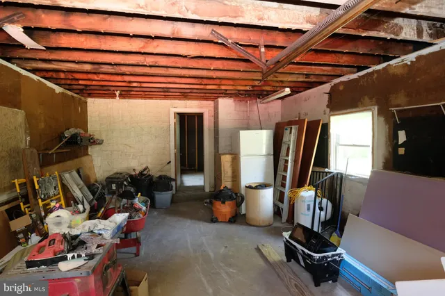 a view of a room with wooden walls