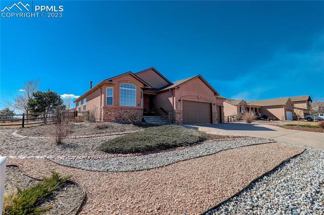 8740 Del Rio Road Peyton, CO 80831 - Photo 2 of 27 Xeriscaped front yard