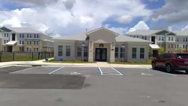 a view of a house with a swimming pool and a yard