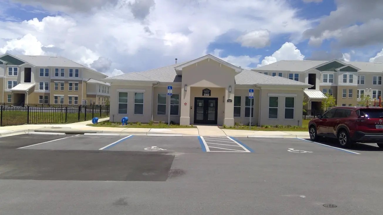 265 West 15th Street Panama City, FL 32401 - Photo 6 of 11 a view of a house with a swimming pool and a yard
