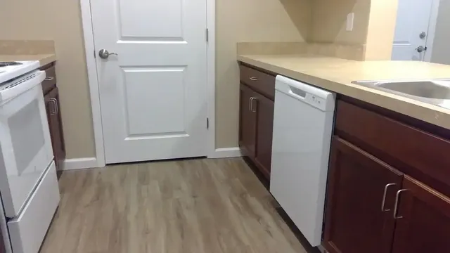 a view of a storage and utility room with washer and dryer