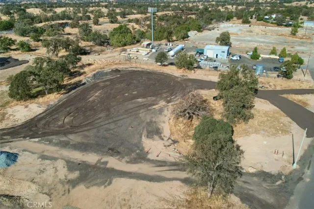 a view of dirt yard with a mountain view