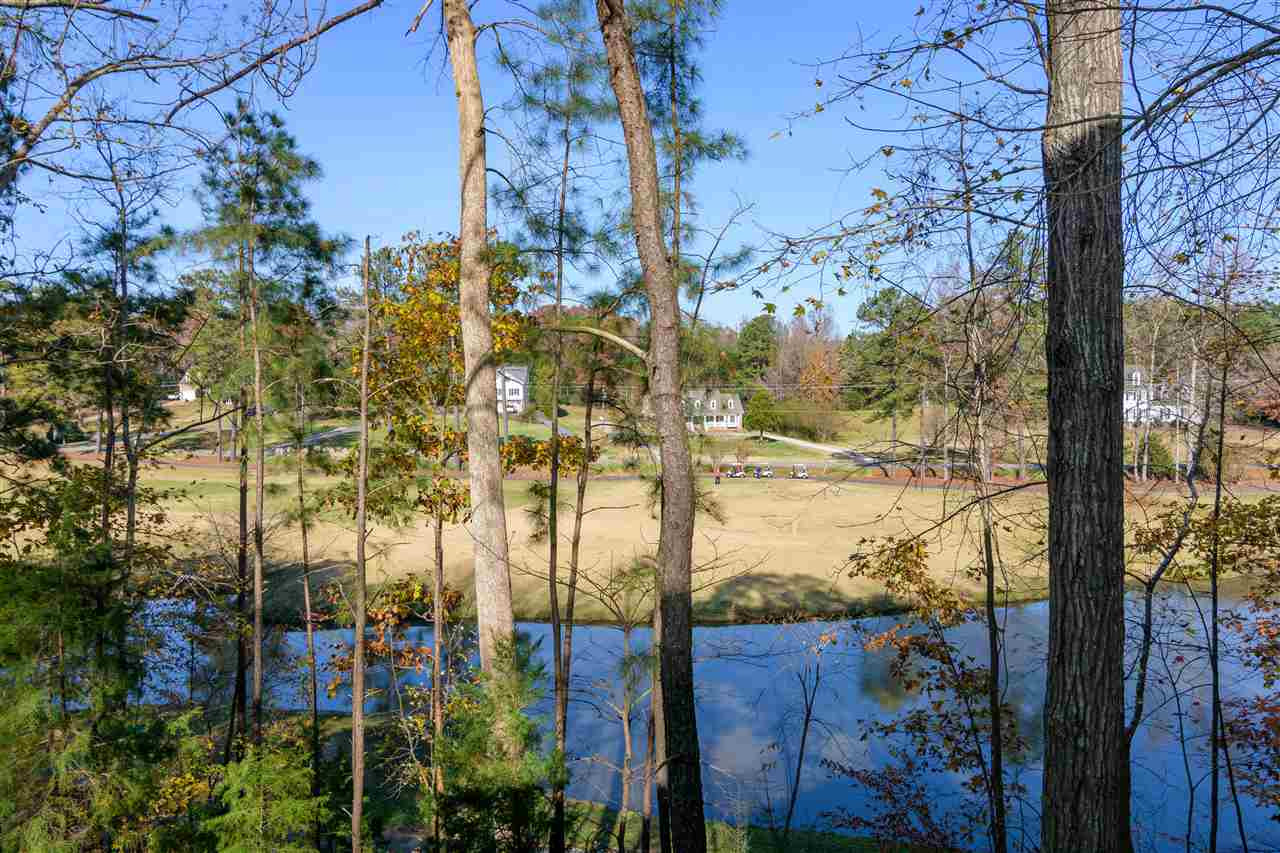 2808 Combe Hill Trail Raleigh, NC 27613 - Photo 4 of 30 Golf course and waterway view on partially wooded lot can't be beat. Huge walk-in workshop ground fl & 900 ft2 3rd fl unf. Attic preplumbed & framed with rooms. Back Porch View