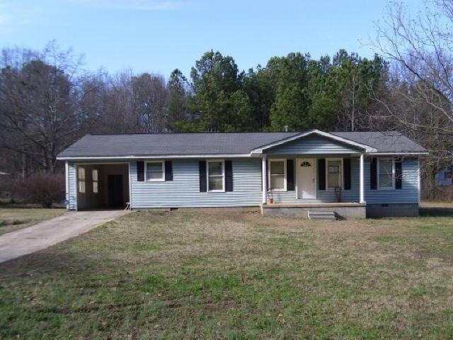 765 Piedmont Road Hull, GA 30646 - Photo 1 of 1 a front view of a house with a garden
