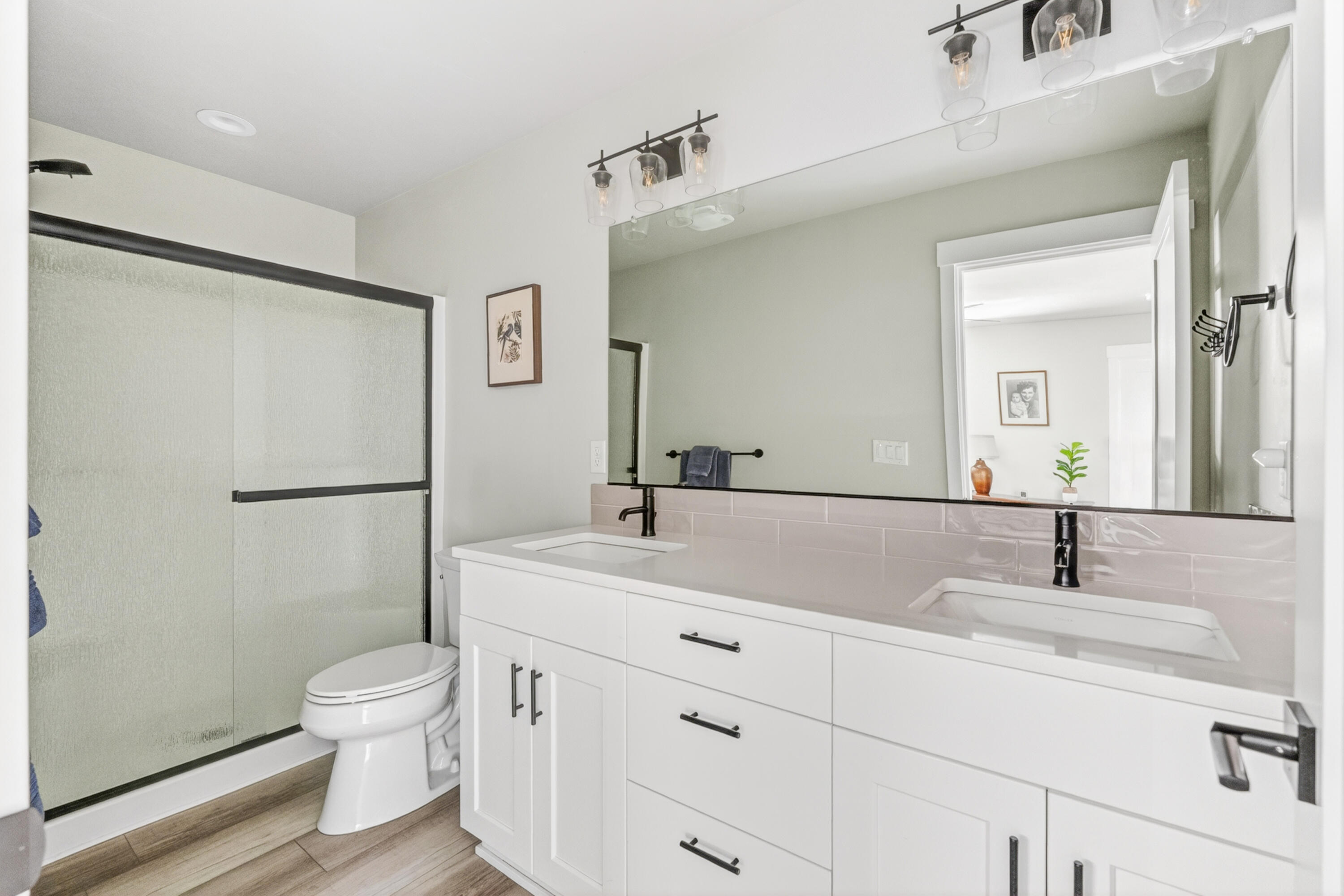 4572 Southwest 37th Street Redmond, OR 97756 - Photo 9 of 19 a bathroom with a sink toilet a mirror and shower
