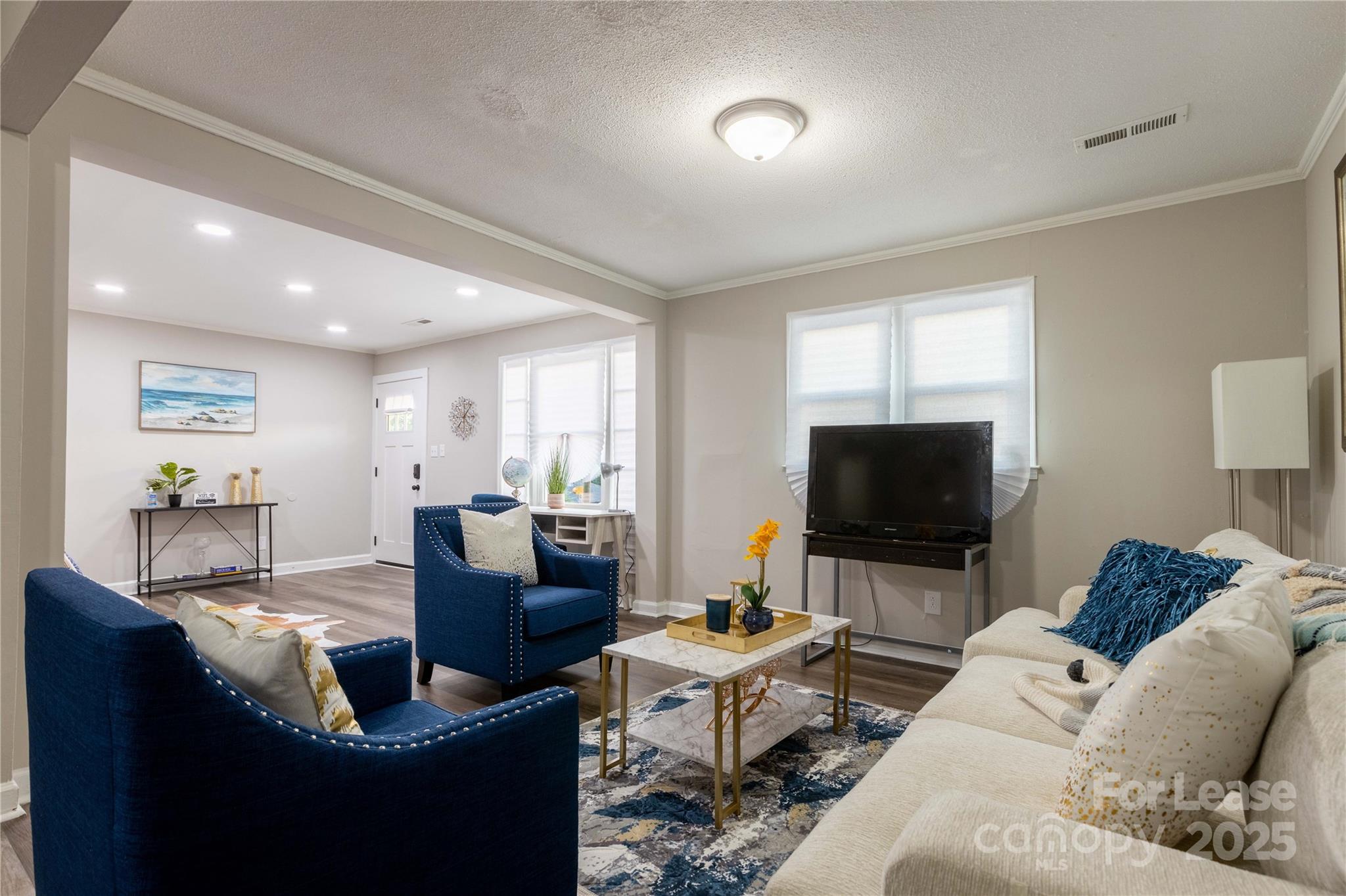 2012 Double Oaks Road Charlotte, NC 28206 - Photo 5 of 14 a living room with furniture and a flat screen tv