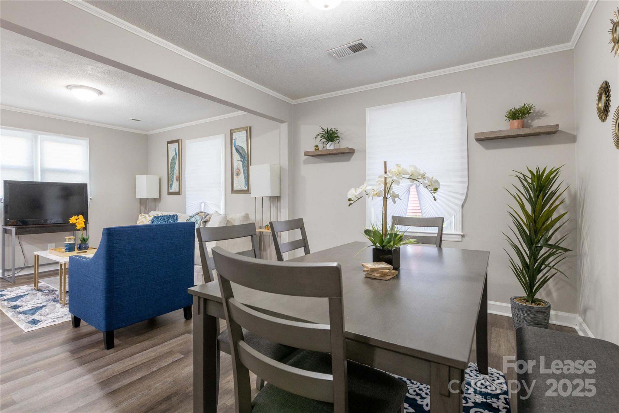2012 Double Oaks Road Charlotte, NC 28206 - Photo 6 of 14 a view of a livingroom with furniture and a flat screen tv