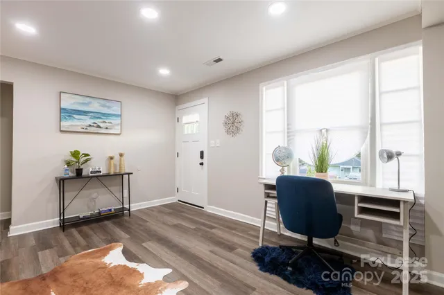 a workspace with furniture and a window