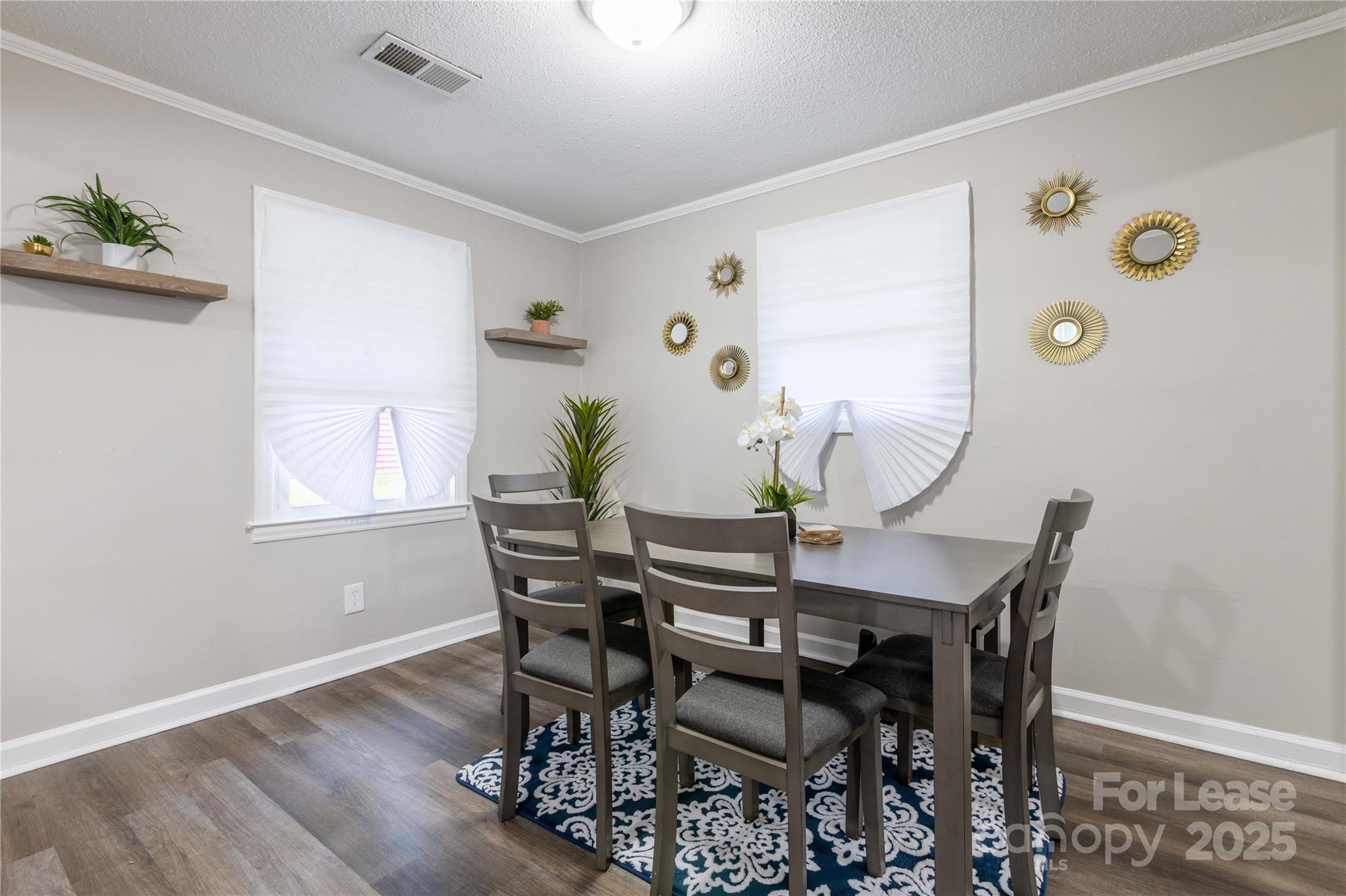 2012 Double Oaks Road Charlotte, NC 28206 - Photo 8 of 14 a view of a dining room with furniture and wooden floor