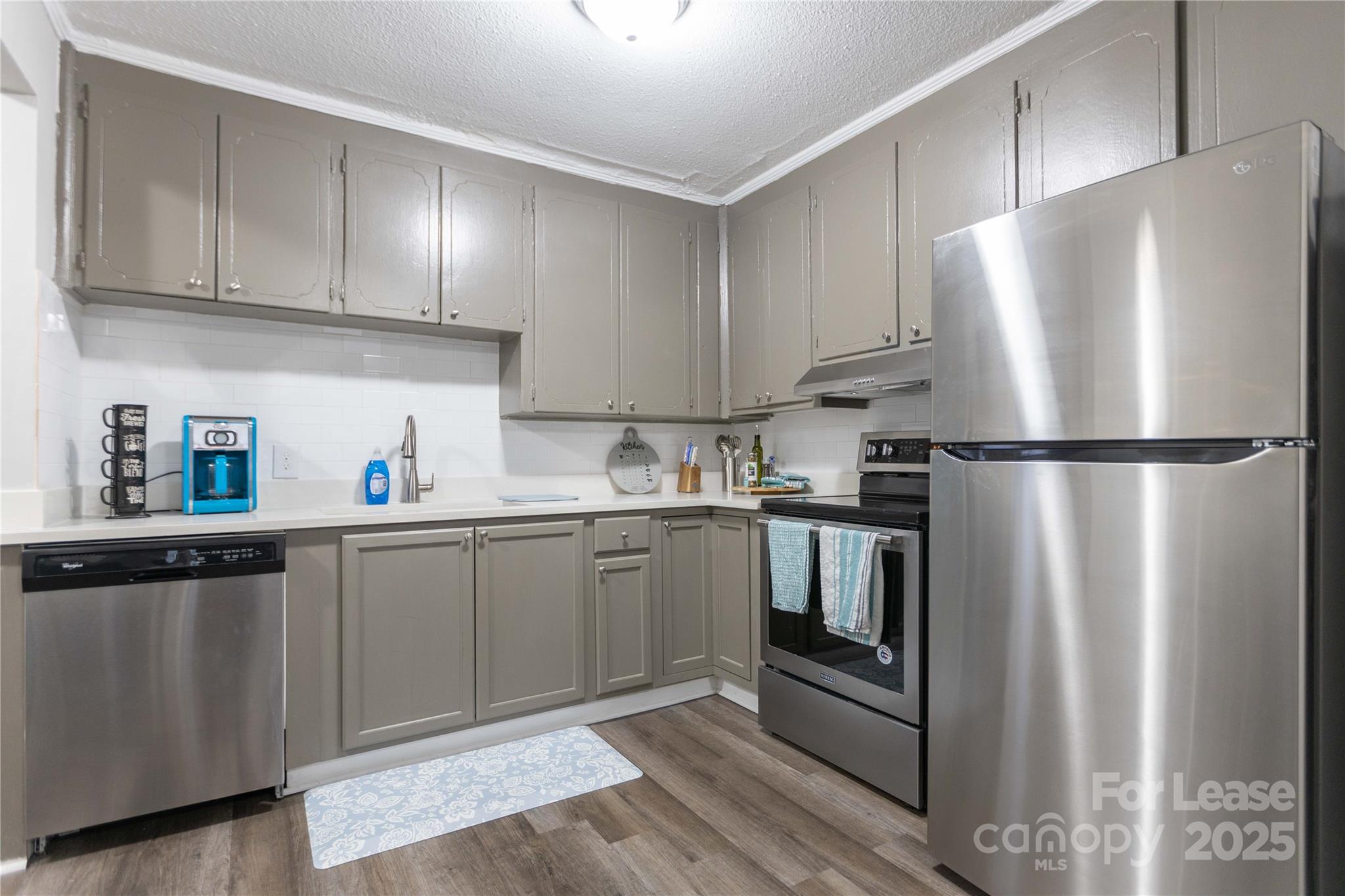 2012 Double Oaks Road Charlotte, NC 28206 - Photo 9 of 14 a kitchen with stainless steel appliances granite countertop a refrigerator and a sink