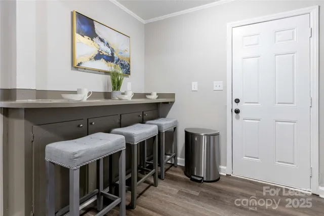 a room with furniture and wooden floor