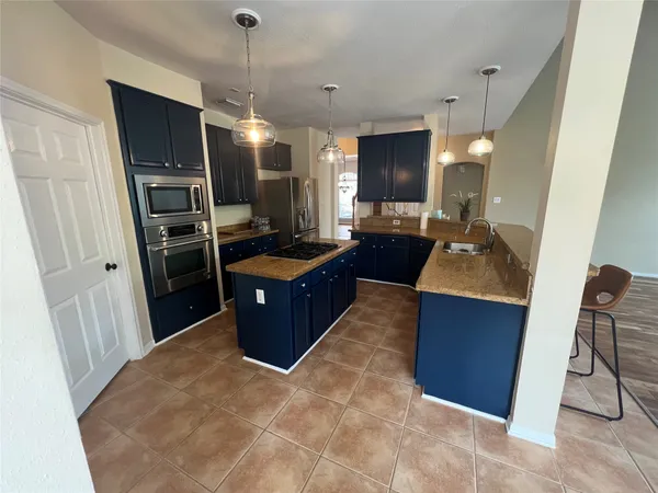 $700,000 | 26 Merit Woods Place, The Woodlands, TX 77382