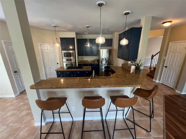 $700,000 | 26 Merit Woods Place, The Woodlands, TX 77382