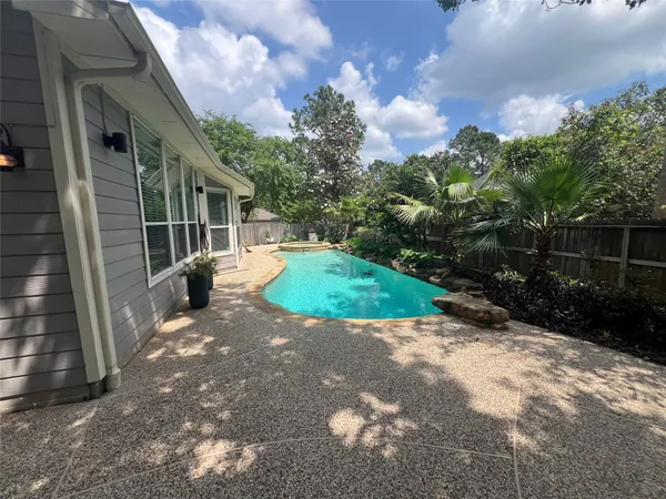 $700,000 | 26 Merit Woods Place, The Woodlands, TX 77382