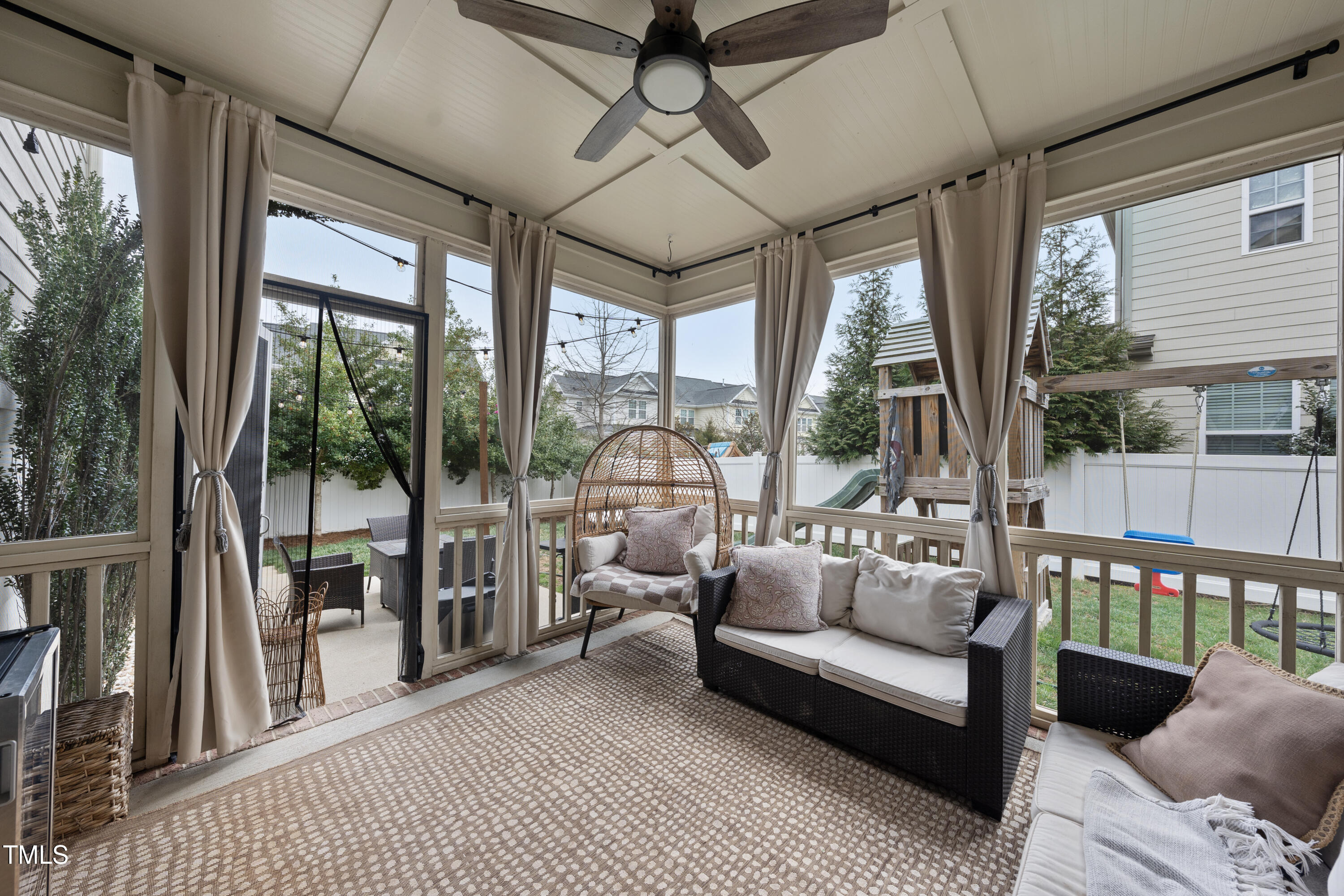 714 Chapanoke Road Raleigh, NC 27603 - Photo 36 of 45 a living room with furniture and a floor to ceiling window