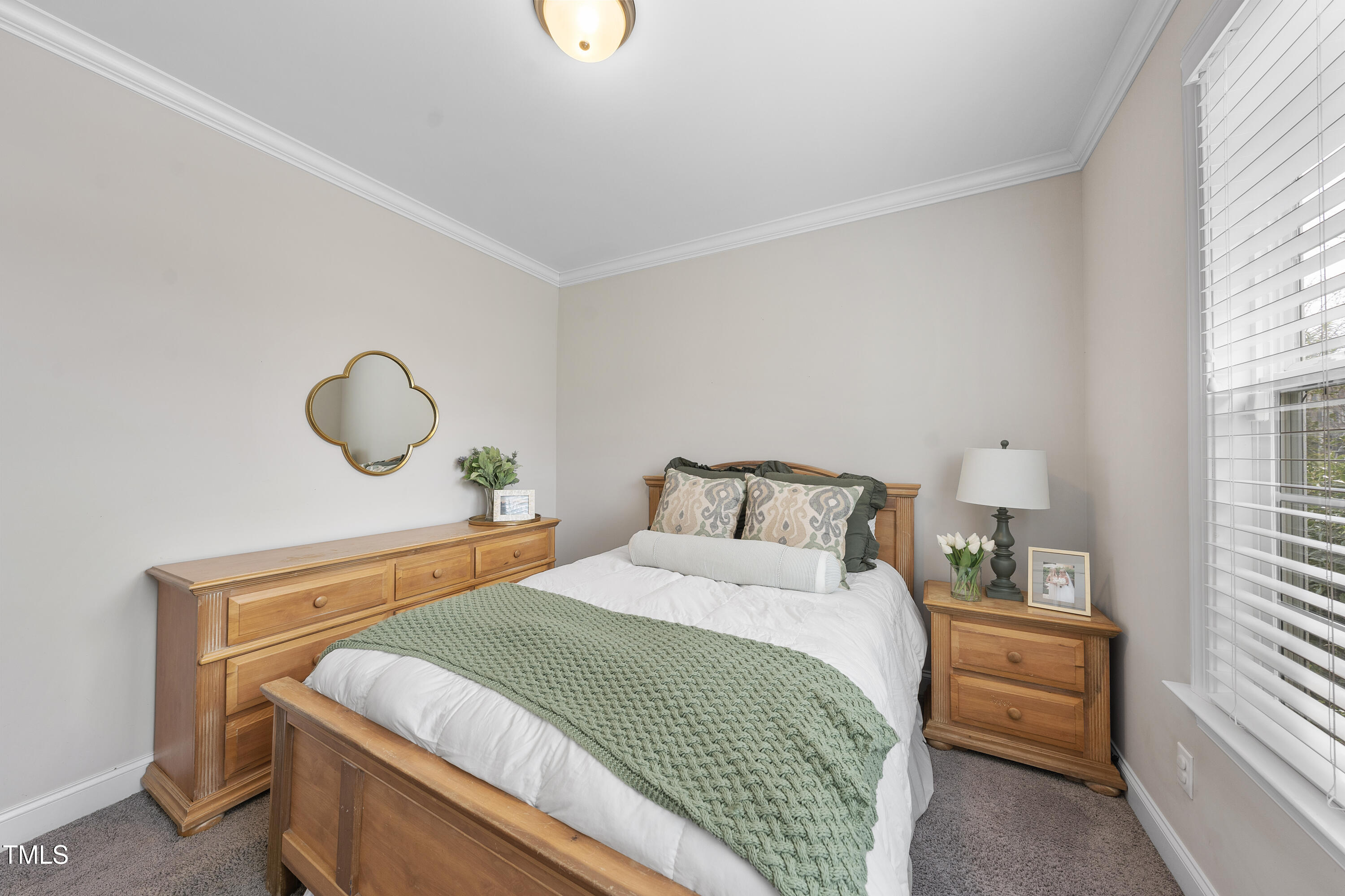 714 Chapanoke Road Raleigh, NC 27603 - Photo 7 of 45 a bedroom with a bed and window