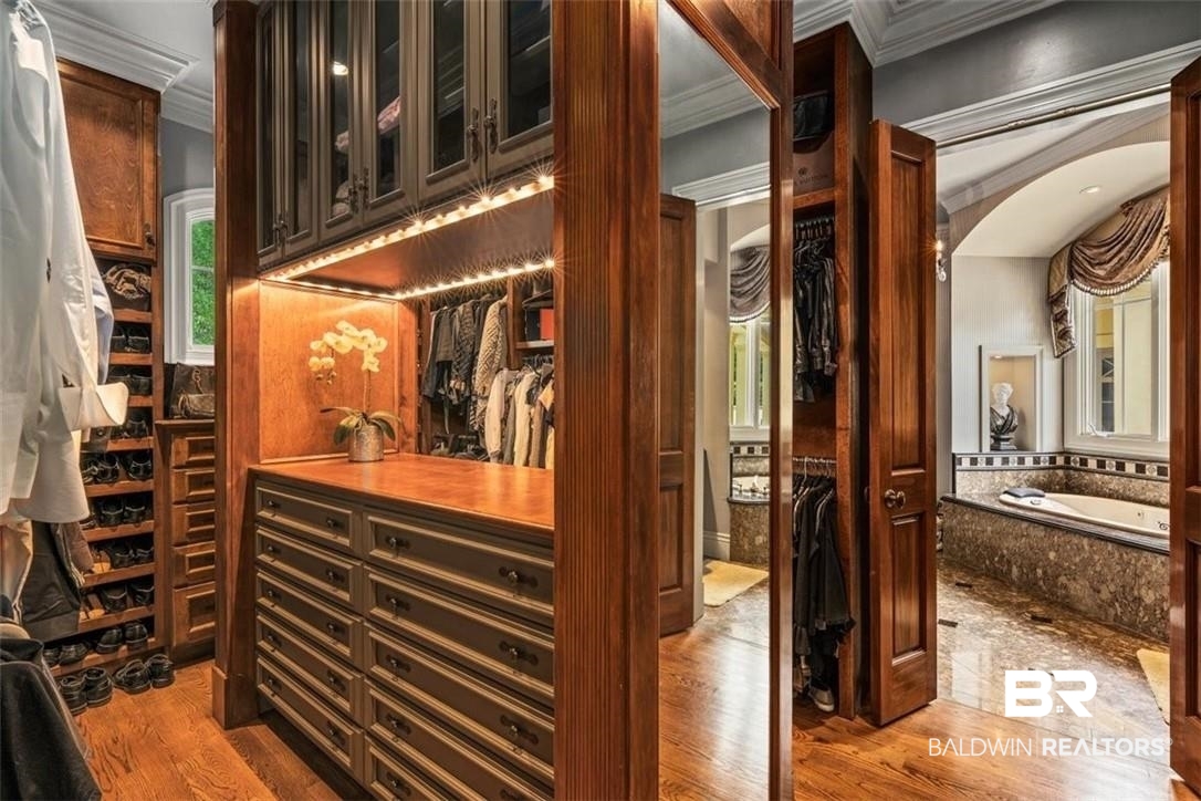 4 Chancery Court Mobile, AL 36608 - Photo 22 of 54 Wine room with crown molding and hardwood / wood-style flooring