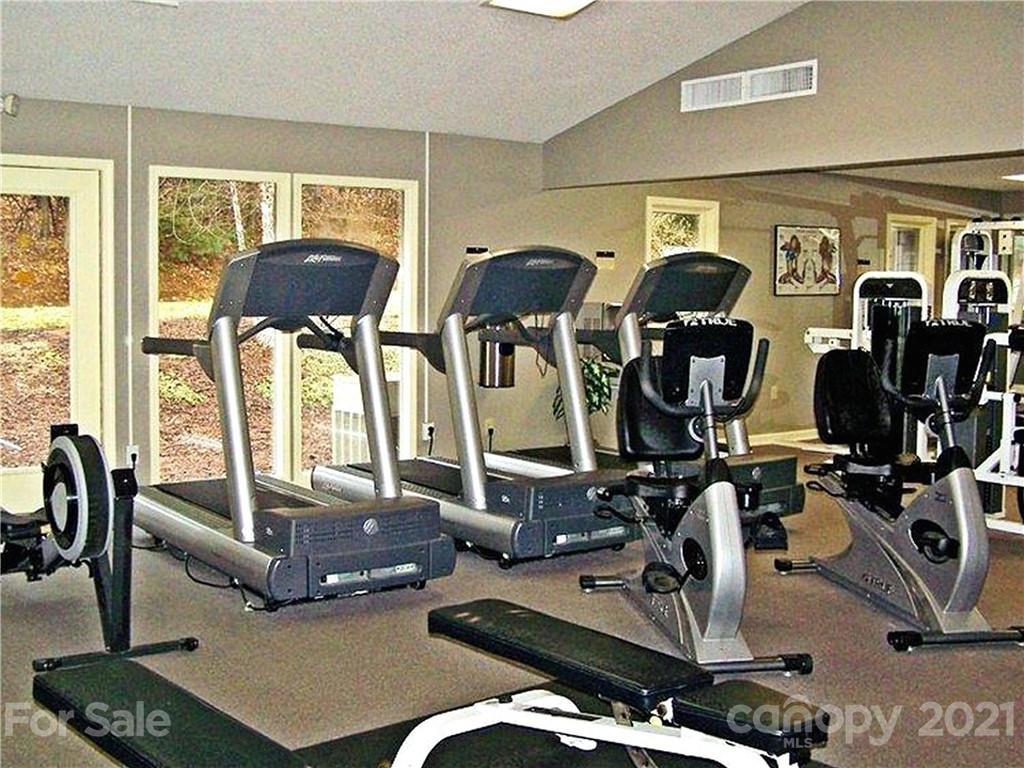 160 Whitney Boulevard, Unit 65 Lake Lure, NC 28746 - Photo 20 of 21 a room with gym equipment