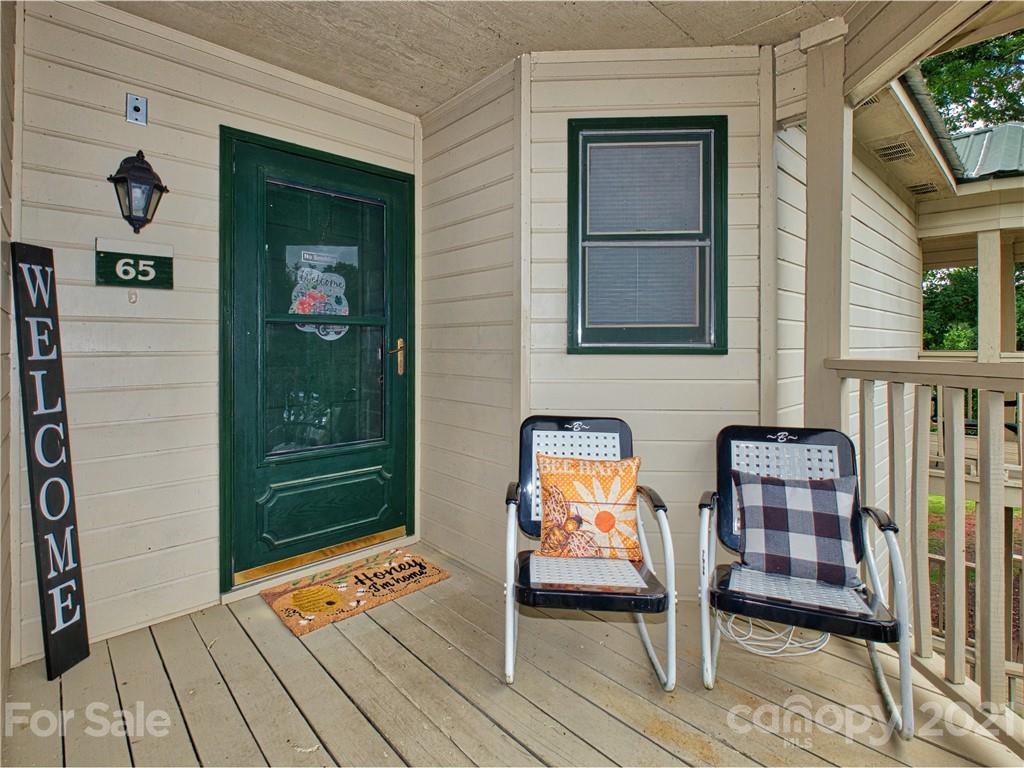 160 Whitney Boulevard, Unit 65 Lake Lure, NC 28746 - Photo 3 of 21 a view of sitting area in front of house