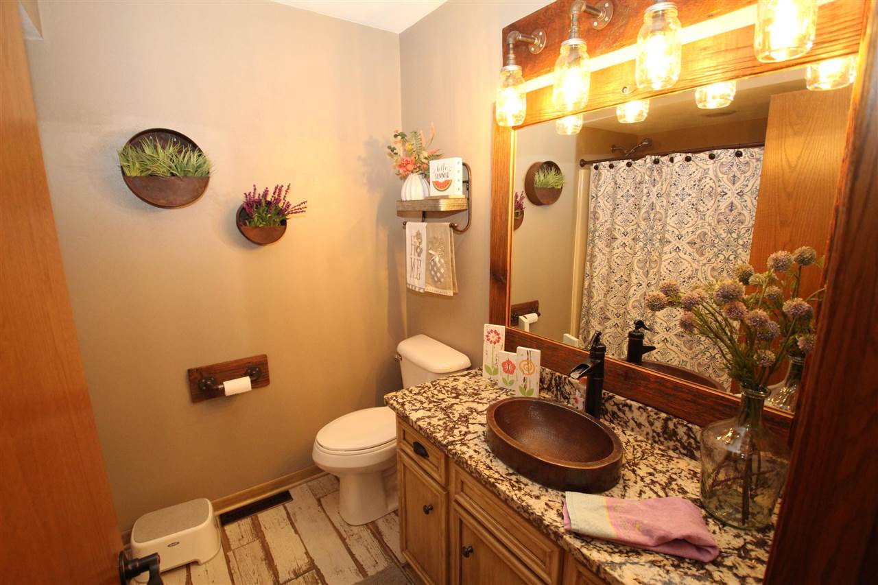 3684 Valerie Road Roscoe, IL 61073 - Photo 11 of 26 a bathroom with a sink mirror vanity and toilet