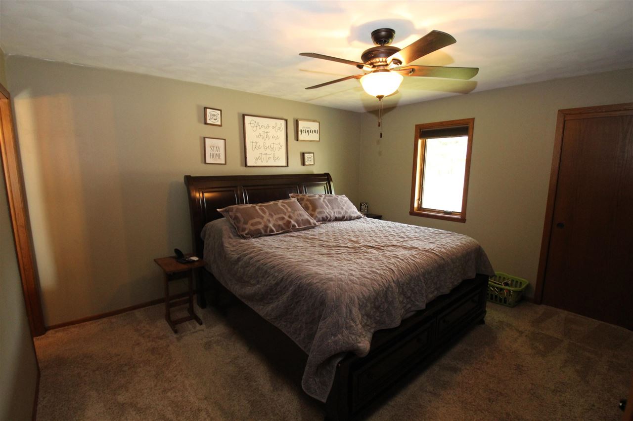 3684 Valerie Road Roscoe, IL 61073 - Photo 12 of 26 a spacious bedroom with a bed and a window