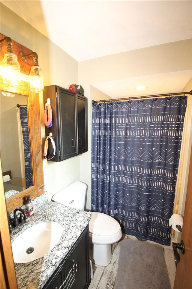 3684 Valerie Road Roscoe, IL 61073 - Photo 13 of 26 a bathroom with a sink toilet and shower