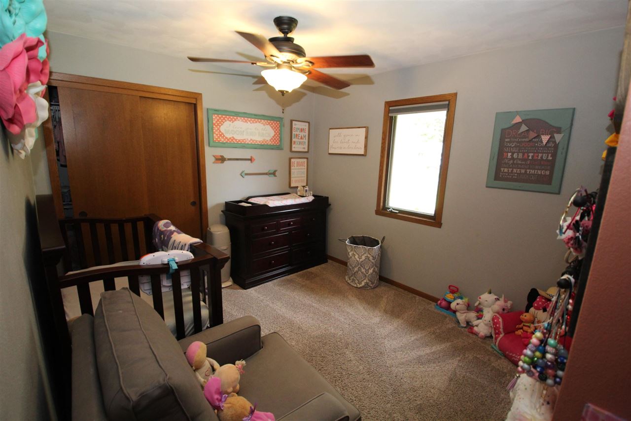 3684 Valerie Road Roscoe, IL 61073 - Photo 14 of 26 a bedroom with furniture and a window