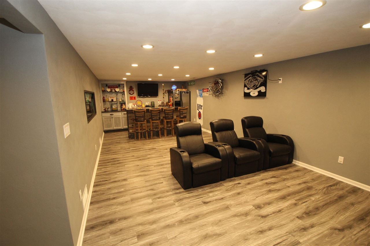3684 Valerie Road Roscoe, IL 61073 - Photo 16 of 26 a living room with furniture and a wooden floor