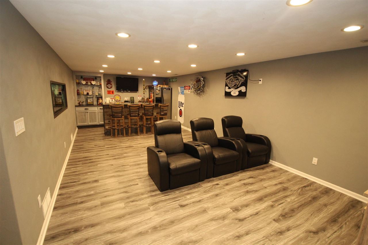 3684 Valerie Road Roscoe, IL 61073 - Photo 20 of 26 a living room with furniture and a wooden floor