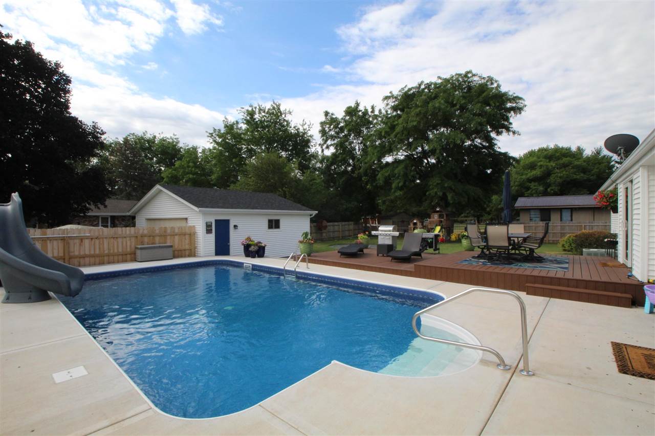 3684 Valerie Road Roscoe, IL 61073 - Photo 26 of 26 a view of swimming pool with lawn chairs and plants