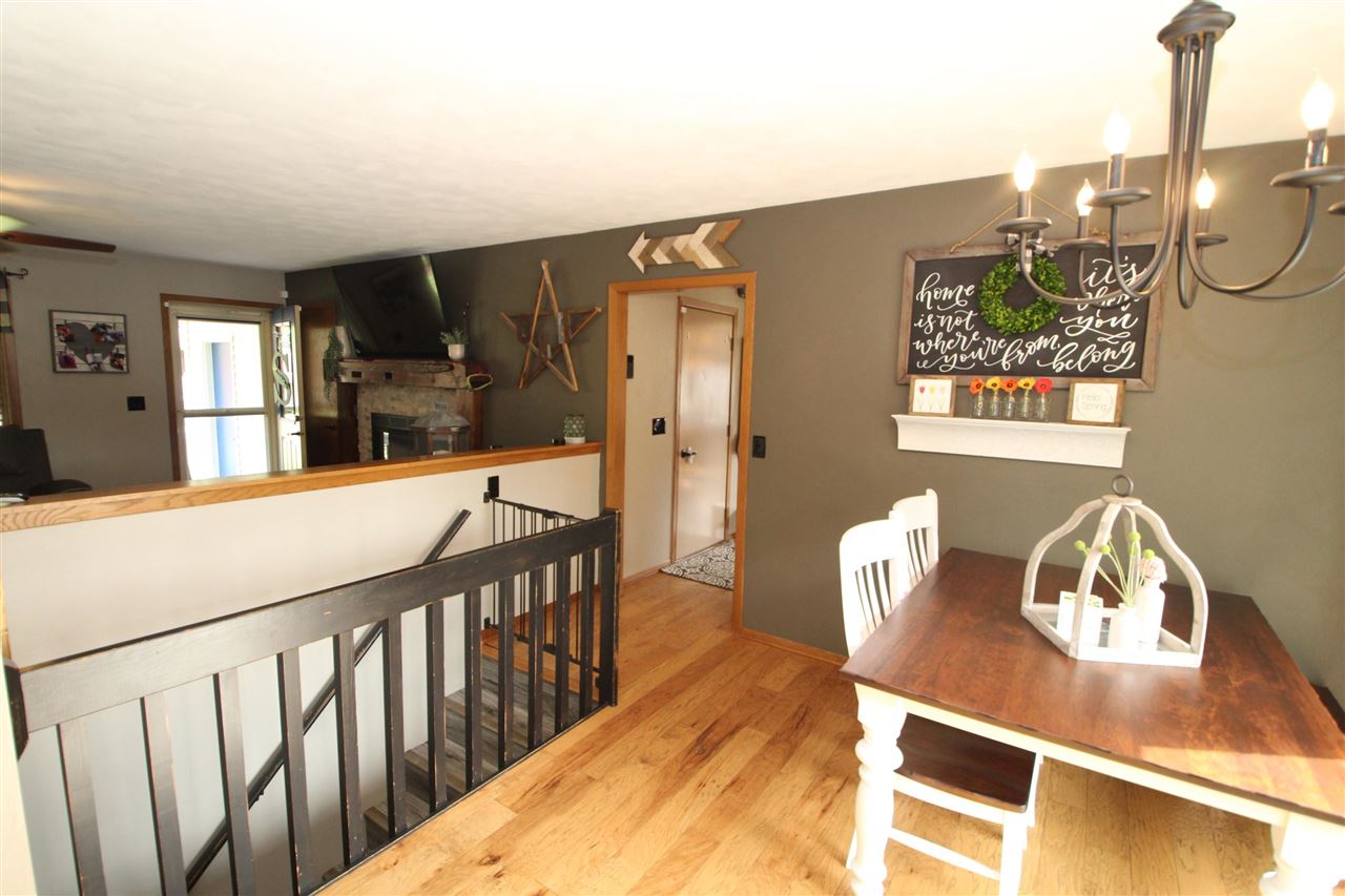 3684 Valerie Road Roscoe, IL 61073 - Photo 7 of 26 a view of a balcony dining table and chairs