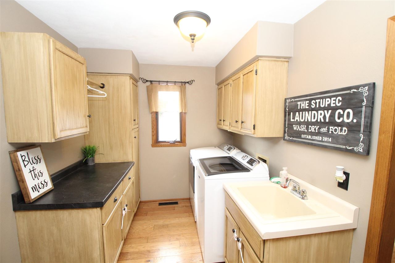 3684 Valerie Road Roscoe, IL 61073 - Photo 9 of 26 a kitchen with a sink a stove and a refrigerator