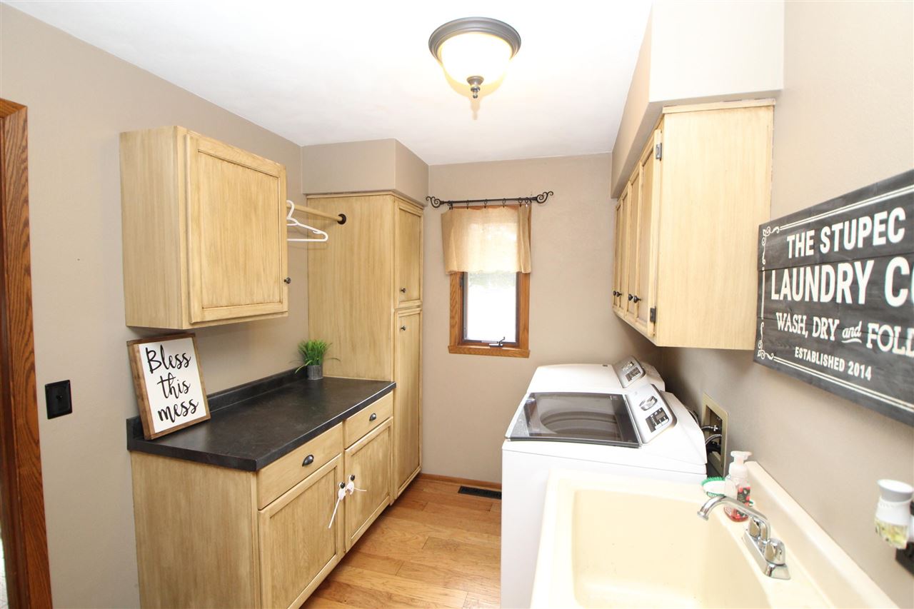 3684 Valerie Road Roscoe, IL 61073 - Photo 10 of 26 a kitchen with granite countertop a sink and a stove top oven