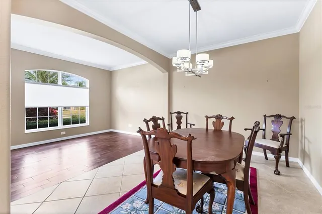 a view of a a dining room with furniture and wooden floor