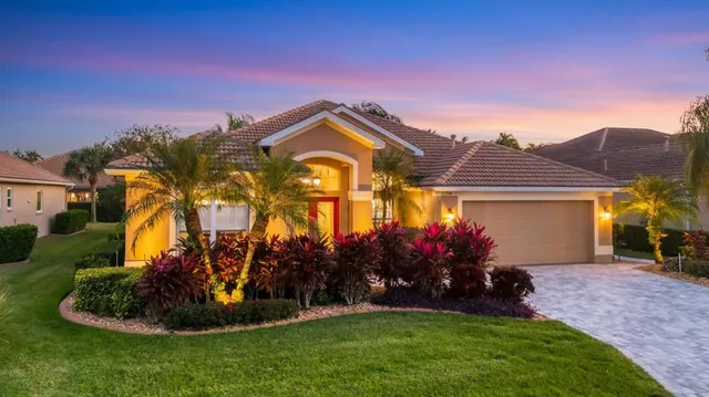 a front view of a house with a yard